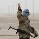 A Libyan rebel soldier flashes the “V for victory” sign as he prepares for battle in the eastern city of Ajdabiya (AFP/Getty Images)